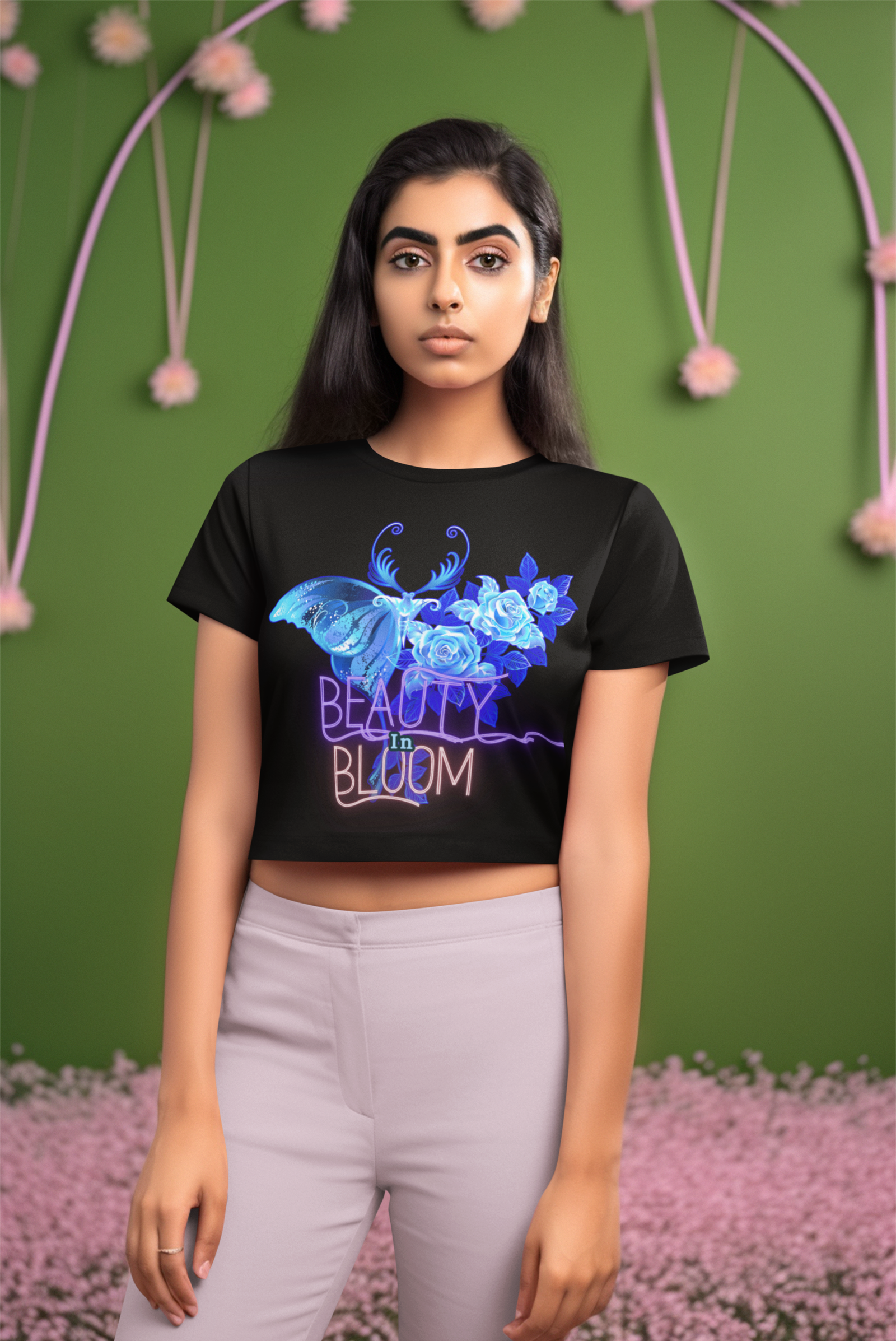 Medium-size black Beauty in Bloom Tee with a vibrant blue butterfly and blooming rose design, blending nature and artistic charm.