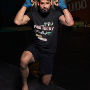 Black Gym Motivation T-Shirt | Pain Today, Power Tomorrow by PodLyft in size Small, featuring motivational workout graphic, ideal for fitness enthusiasts.