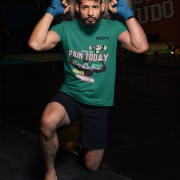 Bottle Green Gym Motivation T-Shirt | Pain Today, Power Tomorrow by PodLyft in size Small, featuring a motivational workout graphic for fitness lovers.