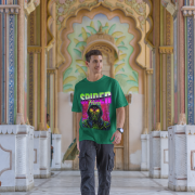 Superhero graphic T-shirt in bottle green, inspired by Spiderman, available in extra small size. Features a vibrant Spiderman design on the front.