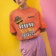 Coral Extra Large t-shirt featuring a rebellious emoji character and Hindi-English typography with a colorful shadow effect. Express your fun-loving attitude with this quirky design!