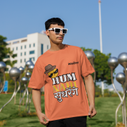 Coral Small t-shirt with a cheeky emoji character in sunglasses and a fedora, alongside bold Hindi-English typography. Perfect for adding a fun, rebellious touch to your look!