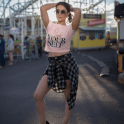 Charming baby pink crop top featuring the "Love Yourself" design with artistic brushstroke lettering and modern neon typography. A stylish statement of self-love and confidence.