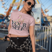 Trendy baby pink crop top with an inspiring "Love Yourself" print, blending soft brushstroke colors with sleek neon text. Designed for comfort and effortless style.