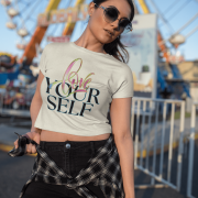 Trendy beige crop top with the inspiring "Love Yourself" message, showcasing artistic lettering and a modern neon glow. Comfortable and chic for everyday fashion.
