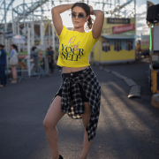 A radiant golden yellow crop top featuring the "Love Yourself" design in artistic brushstroke lettering and sleek neon typography. A perfect statement of self-love and confidence.