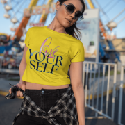 Women's golden yellow crop top with an uplifting "Love Yourself" message in vibrant, artistic typography. Lightweight, breathable, and stylish for any occasion.