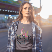Comfortable grey cotton crop top featuring an inspiring "Love Yourself" design, blending artistic brushstrokes and modern typography. Ideal for everyday fashion and motivation.