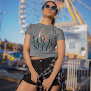 Soft and fashionable grey crop top with a unique "Love Yourself" print in shades of pink, green, and neon blue. A stylish way to embrace self-love and positivity.