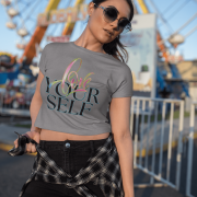 Stylish grey crop top with an empowering "Love Yourself" message in vibrant, artistic typography. Lightweight, breathable, and designed for confidence and comfort.