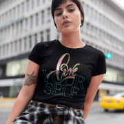 Stylish young woman wearing the Love Yourself crop top in black, featuring an elegant brushstroke and neon typography design. A trendy and empowering fashion statement for self-love and confidence.