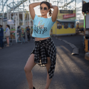 Chic sky blue crop top featuring the "Love Yourself" design with artistic brushstroke lettering and sleek neon typography. A perfect blend of style and self-love.