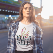Elegant white crop top with an eye-catching "Love Yourself" design, combining soft artistic elements with a bold neon effect. Perfect for a confident and trendy look.