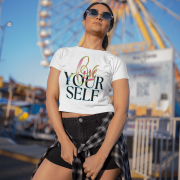 Trendy white crop top with an inspiring "Love Yourself" message, blending artistic brushstroke textures with a glowing neon effect. Perfect for a bold and confident look.