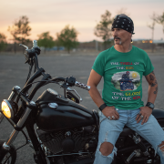 Double extra-large bottle green Thrill Rider tee, perfect for motorcycle enthusiasts who live for adventure. With its detailed biker design and striking typography, this tee makes a powerful statement for road warriors.