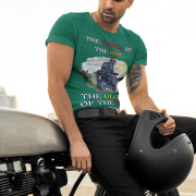 Medium-sized bottle green Thrill Rider tee featuring a high-energy motorbike rider against a scenic outdoor backdrop. The bold typography and adventurous design make this an ideal tee for motorcycle lovers and thrill-seekers.