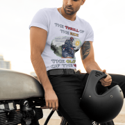 Medium-sized lavender Thrill Rider tee featuring a high-energy motorbike rider against a scenic outdoor backdrop. The bold typography and adventurous design make this an ideal tee for motorcycle lovers and thrill-seekers.