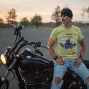 Double extra-large olive green Thrill Rider tee, perfect for motorcycle enthusiasts who live for adventure. With its detailed biker design and striking typography, this tee makes a powerful statement for road warriors.