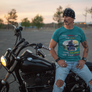 Double extra-large petrol blue Thrill Rider tee, perfect for motorcycle enthusiasts who live for adventure. With its detailed biker design and striking typography, this tee makes a powerful statement for road warriors.