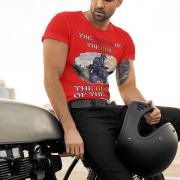 Medium-sized red Thrill Rider tee featuring a high-energy motorbike rider against a scenic outdoor backdrop. The bold typography and adventurous design make this an ideal tee for motorcycle lovers and thrill-seekers.