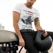 Medium-sized white Thrill Rider tee featuring a high-energy motorbike rider against a scenic outdoor backdrop. The bold typography and adventurous design make this an ideal tee for motorcycle lovers and thrill-seekers.