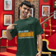 Comfortable bottle green oversized T-shirt with an inspiring 'CREATE YOUR SUNSHINE EVEN ON THE CLOUDIEST DAYS' design. Includes vibrant sky-blue, orange/yellow, and white text with a sun icon. DTG-printed on high-quality 240 GSM cotton. Extra Large size.