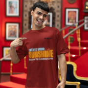 Comfortable maroon oversized T-shirt with an inspiring 'CREATE YOUR SUNSHINE EVEN ON THE CLOUDIEST DAYS' design. Includes vibrant sky-blue, orange/yellow, and white text with a sun icon. DTG-printed on high-quality 240 GSM cotton. Extra Large size.