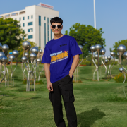 Navy blue oversized T-shirt with a motivational 'CREATE YOUR SUNSHINE EVEN ON THE CLOUDIEST DAYS' design. Bright sky-blue, orange/yellow, and white text with a sun icon. DTG-printed on durable 240 GSM cotton fabric. Double Extra Large size.