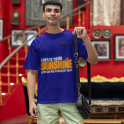 Navy blue oversized T-shirt featuring a motivational design with 'CREATE YOUR SUNSHINE EVEN ON THE CLOUDIEST DAYS' in sky-blue, warm orange/yellow, and white text. Includes a sun icon, printed using DTG on premium 240 GSM cotton fabric. Extra Small size.