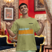 Motivational olive green oversized T-shirt with a bold 'CREATE YOUR SUNSHINE EVEN ON THE CLOUDIEST DAYS' design. Vibrant sky-blue, orange/yellow, and white text with a sun icon. DTG-printed on durable 240 GSM cotton fabric. Small size.