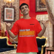 Bold red oversized T-shirt with a vibrant 'CREATE YOUR SUNSHINE EVEN ON THE CLOUDIEST DAYS' design. Features sky-blue, orange/yellow, and white text with a sun icon. DTG-printed on high-quality 240 GSM cotton. Small size.