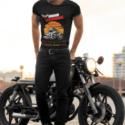 Medium-sized black Road Warrior tee featuring a dynamic motorcyclist silhouette against a fiery sunset. The bold design, including "ROAD WARRIOR" in bold letters, conveys the spirit of adventure and freedom on the open road.