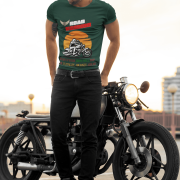 Medium-sized bottle green Road Warrior tee featuring a dynamic motorcyclist silhouette against a fiery sunset. The bold design, including "ROAD WARRIOR" in capitalized letters and a winged tire emblem, embodies the strength and adventure of riders.