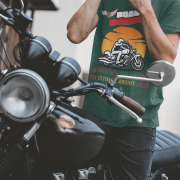 Bottle green Road Warrior tee in small size, designed for motorcycle enthusiasts who embrace freedom and speed. The striking biker graphic, "ROAD WARRIOR" typography, and motivational message create a bold statement for riders who conquer the road.