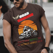 Coffee brown Road Warrior tee in extra small size, featuring a bold motorcyclist graphic against a vibrant orange sunset. The "ROAD WARRIOR" text in white and red, along with the winged tire emblem and motivational phrase, makes this tee perfect for fearless riders and adventure seekers.