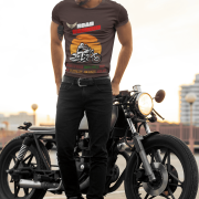 Medium-sized coffee brown Road Warrior tee featuring a dynamic motorcyclist riding through the open road against a fiery sunset. The bold "ROAD WARRIOR" typography and motivational text symbolize resilience, speed, and the ultimate biking spirit.