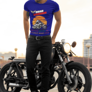 Medium-sized navy blue Road Warrior tee featuring a dynamic motorcyclist riding through the open road against a vibrant sunset. The bold "ROAD WARRIOR" typography and motivational message symbolize resilience, freedom, and a fearless mindset.