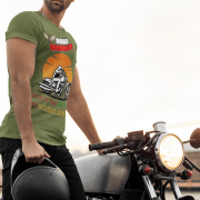 Extra-large olive green Road Warrior tee with a striking motorcyclist design, bold typography, and an eye-catching sunset. Perfect for riders who embrace adventure and live for the thrill of the road, this tee is a statement of strength and determination.