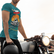 Extra-large petrol blue Road Warrior tee with a striking motorcyclist design, bold typography, and an eye-catching sunset. Perfect for riders who embrace adventure and live for the thrill of the road, this tee is a statement of strength and determination.
