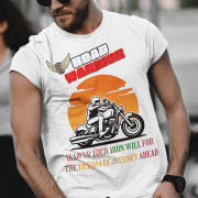 White Road Warrior tee in extra small size, featuring a bold motorcyclist graphic against a fiery orange sunset. The "ROAD WARRIOR" text in white and red, combined with the winged tire emblem and motivational phrase, makes this tee perfect for fearless bikers and adventure seekers.