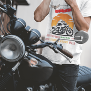 White Road Warrior tee in small size, designed for bikers who embrace the open road. The striking motorcyclist silhouette, bold typography, and adventurous sunset backdrop create a powerful and stylish biker statement.