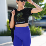Confident and stylish, a woman wears the Blooming Soul Tee in black, featuring an elegant floral line art design. This chic and modern tee from PodLyft blends fashion with artistic expression, perfect for a bold yet feminine look.