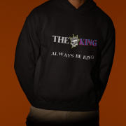 A black King Reigns Hoodie featuring a bold "THE KING" graphic with a crowned skull design and the phrase "ALWAYS BE KING" printed below. The design combines gothic and modern typography, making a powerful statement. Perfect for men who embrace confidence and leadership.