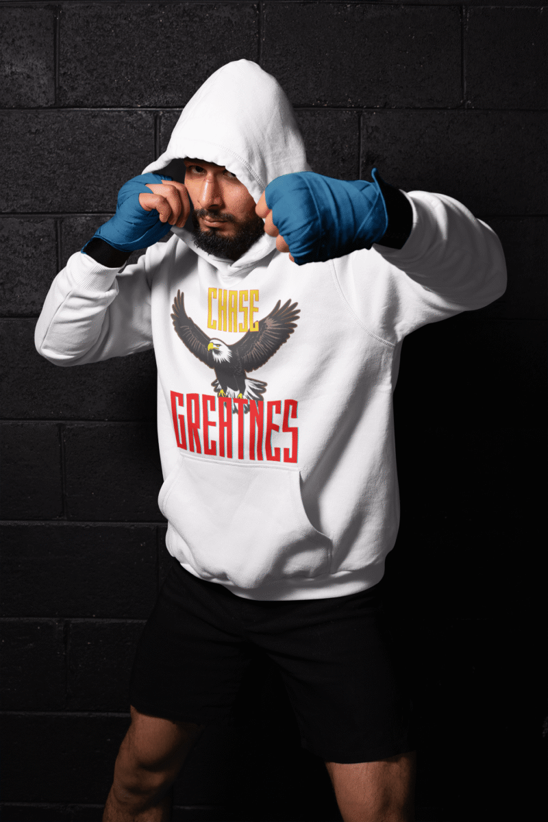 Chase Greatness Hoodie in crisp white, featuring a bold eagle graphic with powerful typography. Perfect for those who strive for strength, determination, and success. | PodLyft