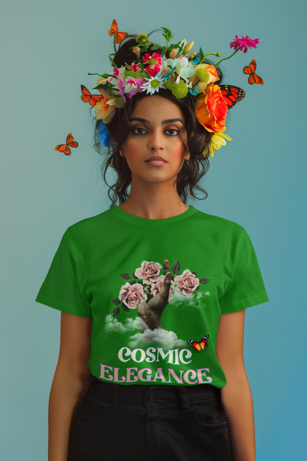 A stunning model wearing the Cosmic Elegance t-shirt in vibrant green, featuring a dreamy floral art design with a surreal hand reaching through clouds, surrounded by blooming roses and a butterfly. She is adorned with an intricate floral crown, with butterflies fluttering around, embodying a blend of nature and cosmic beauty. A perfect artistic fashion statement.