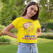 Woman in a vibrant golden yellow 'Divine Feminine' T-shirt with a stunning floral line-art design. A bold and radiant expression of femininity, available at PodLyft.