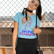 Woman wearing a refreshing sky blue 'Divine Feminine' T-shirt featuring a graceful floral line-art design. A soft and airy fashion piece, available at PodLyft.