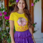 Golden Yellow Inspirational Floral Tee with an artistic woman and floral design, promoting positivity with the quote 'We Are All Wonderful.' A stylish and motivational fashion choice.