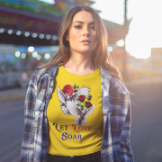 "Let Love Soar Tee – Romantic Dove & Rose Design in Golden Yellow by PodLyft." A vibrant golden yellow tee with a beautiful dove and rose artwork, symbolizing love and positivity. Perfect for adding warmth to your wardrobe.