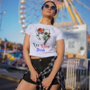 "Let Love Soar Tee – Romantic Dove & Rose Design in Lavender by PodLyft." A dreamy lavender tee featuring doves carrying roses with "Let Love Soar" text. A soft and graceful look for everyday wear.